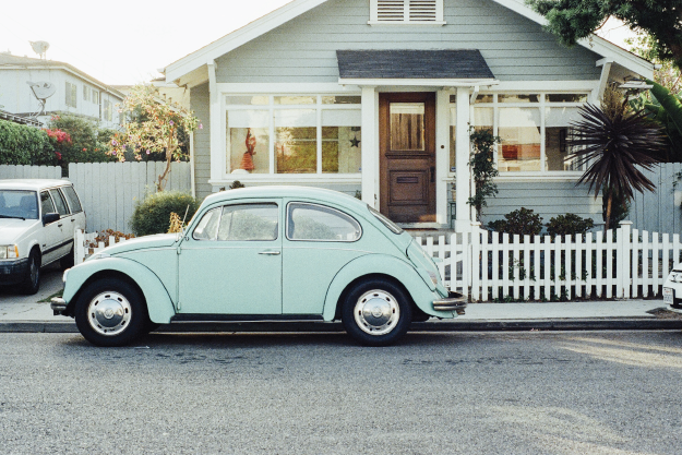 Blue Car Outside of Home Blue Car Outside of House